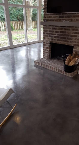 epoxy coating transforming the flooring in a 1970s home by concrete by design