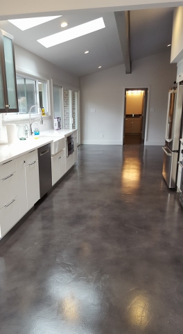 epoxy coating transforming the flooring in a 1970s home by concrete by design