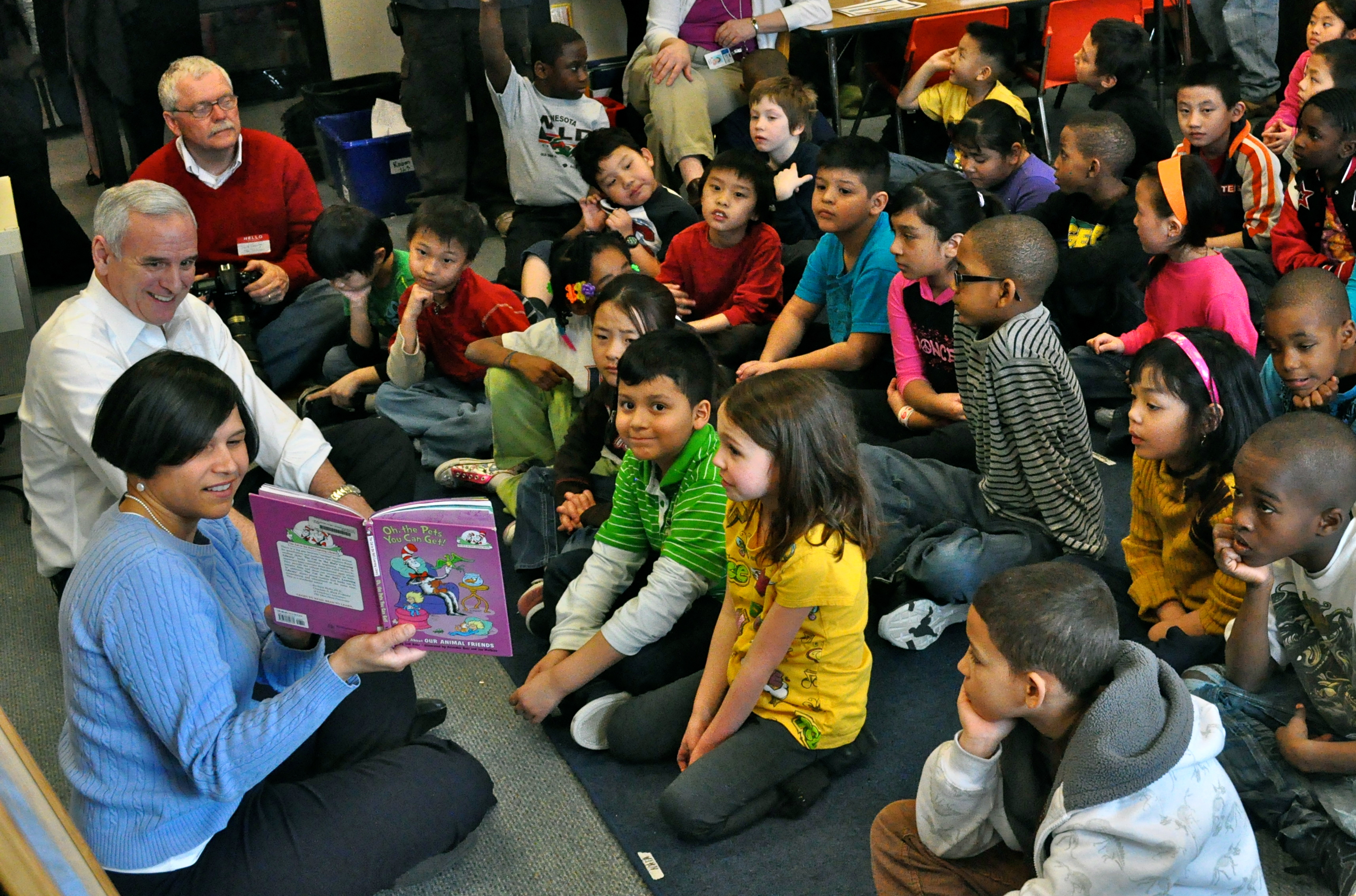 Governor of Minnesota observing the read across America day with the children
